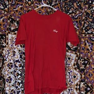 Red short-sleeved obey shirt with rose detail.